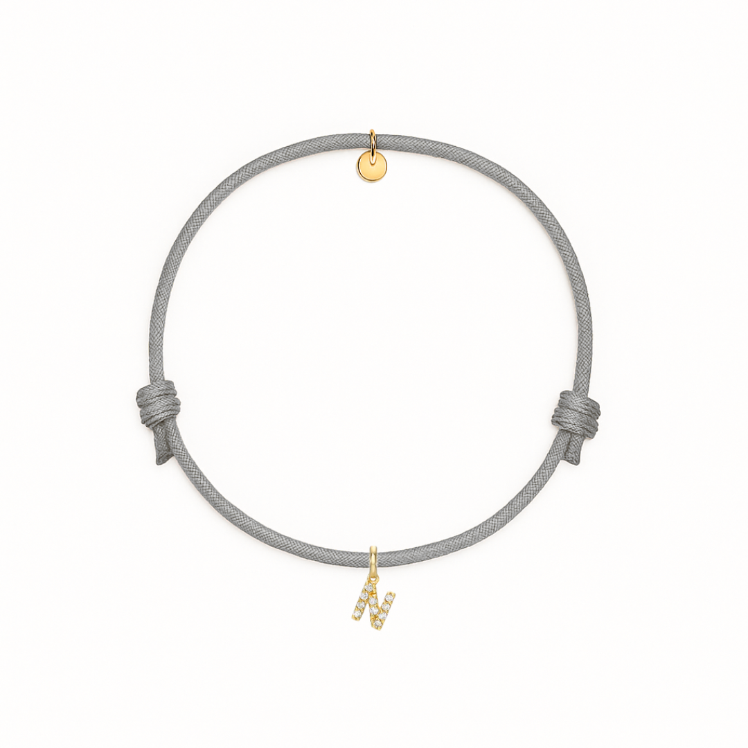 bracciale con cordino grigio con iniziale N oro