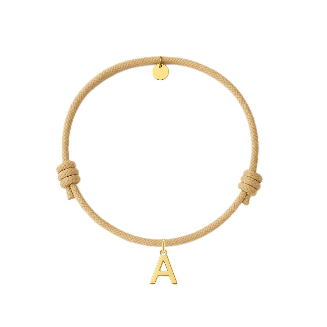 bracciale con cordino color sabbia e ciondolo iniziale dorata in argento 925 personalizzabile