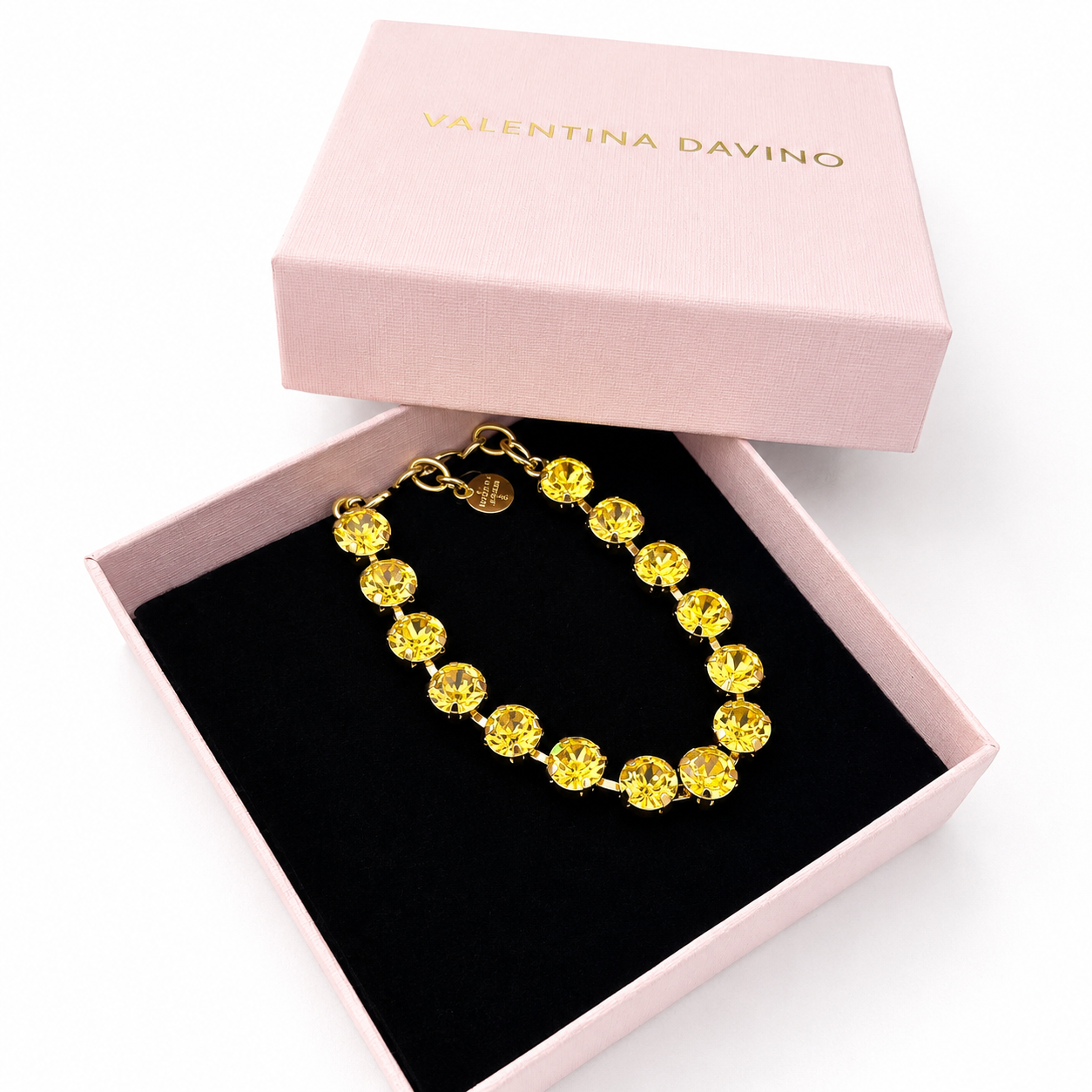 bracciale con cristalli oro e giallo in packaging rosa