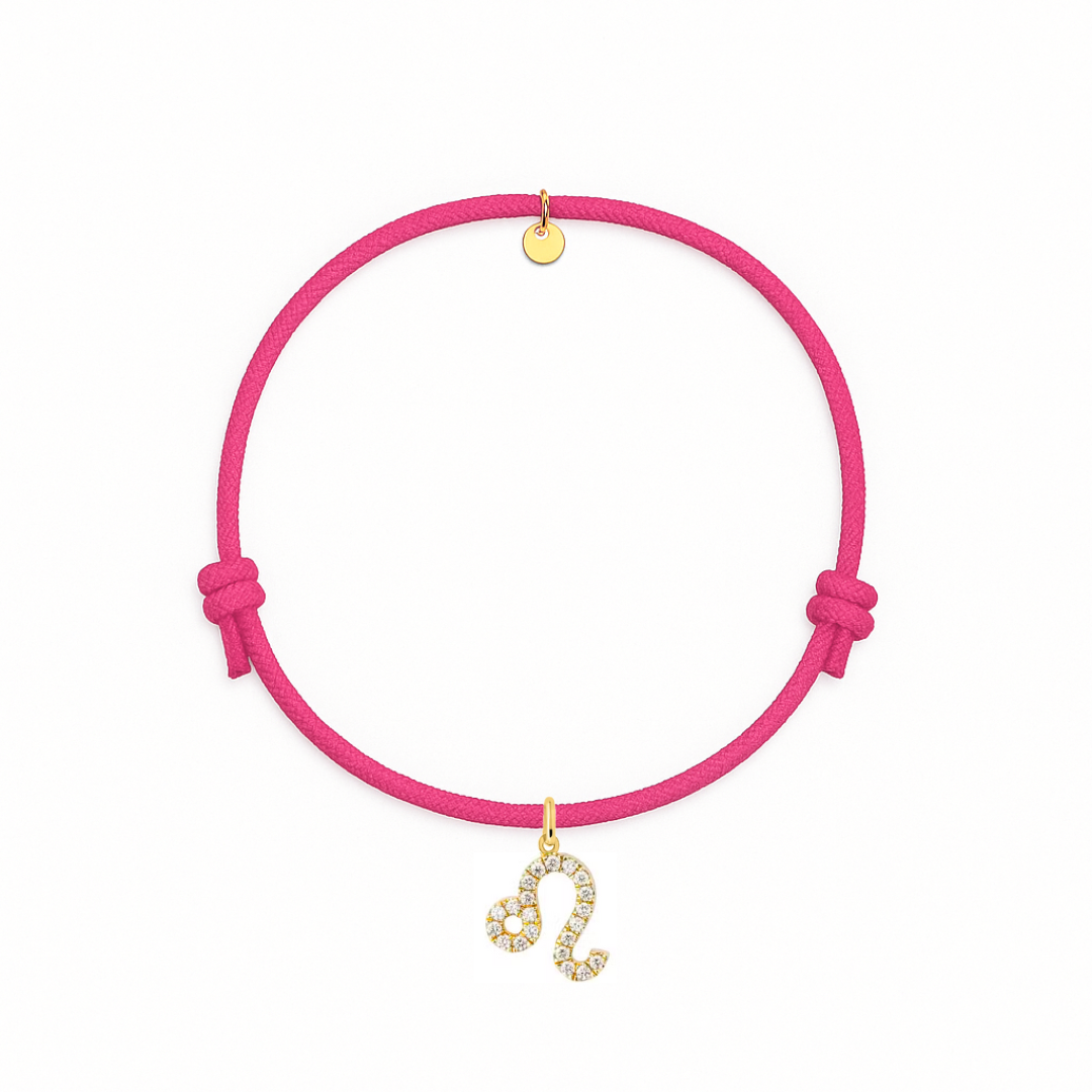 bracciale con cordino fucsia e ciondolo dorato e zirconi