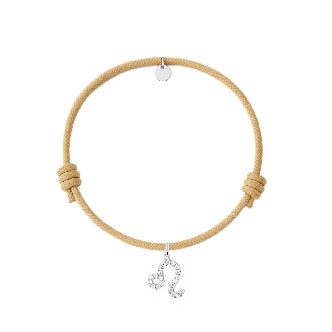 bracciale con cordino beige e ciondoli in argento e zirconi