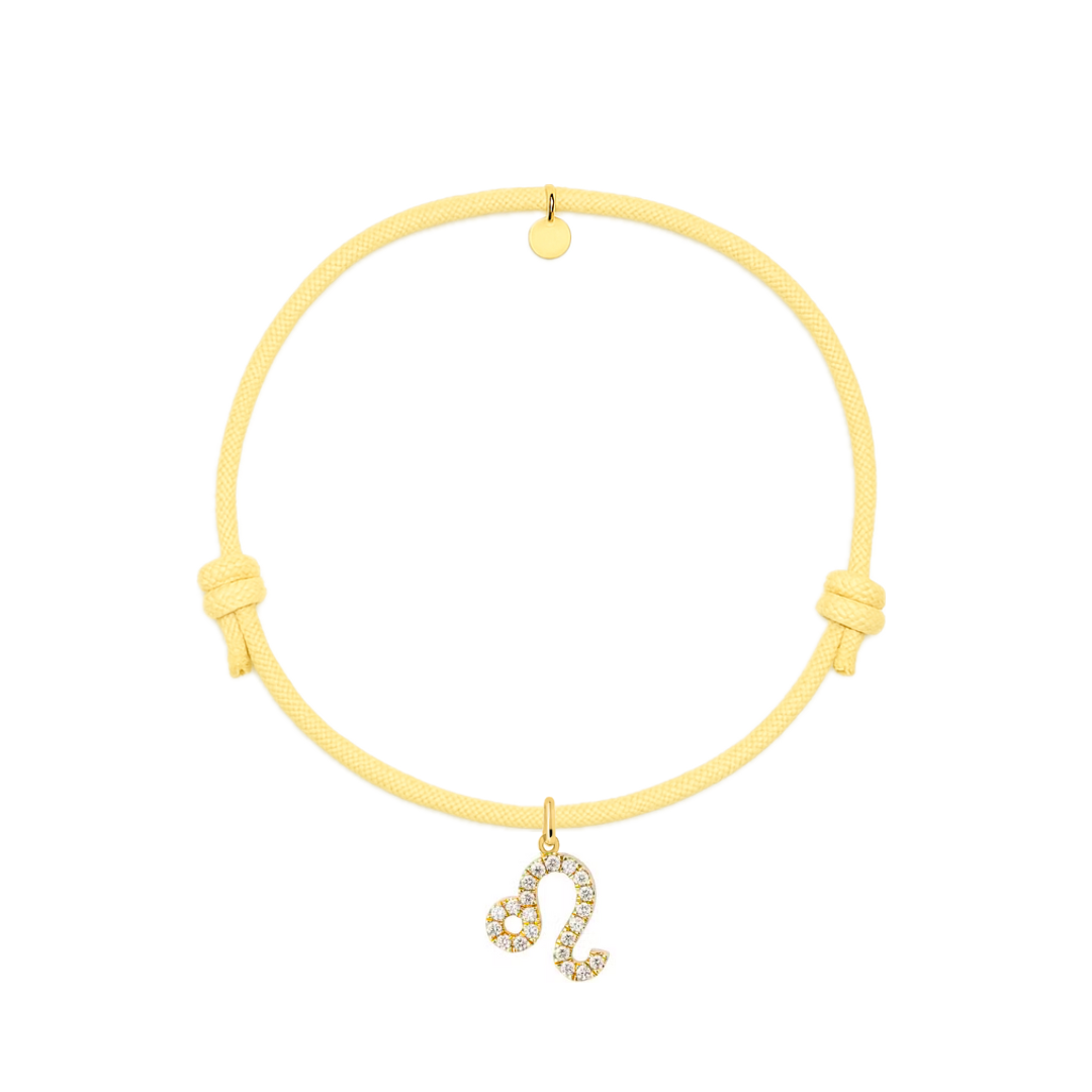 bracciale con cordino giallo e ciondolo dorato con zirconi.