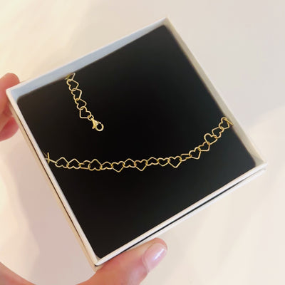 bracciale con cuori concatenati dorato in argento 925