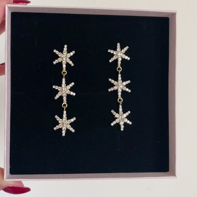 orecchini lunghi di stelle composte da swarovski con rifiniture oro 